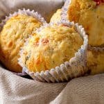 Close up savory muffins on a beige cloth.