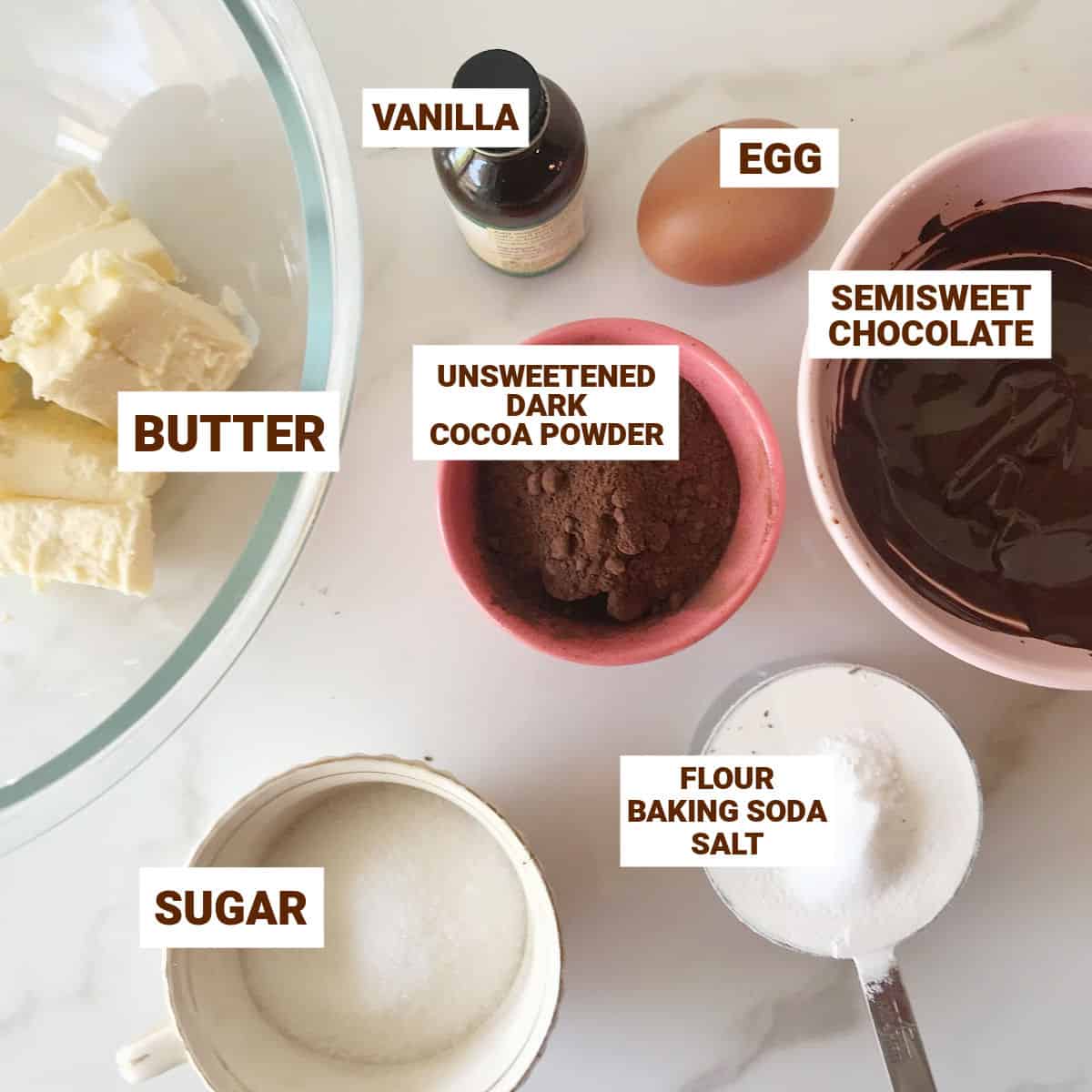 White surface with bowls of ingredients for chocolate cookies; text overlay.