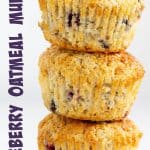 Three blueberry muffins in a stack on white background, text on the side