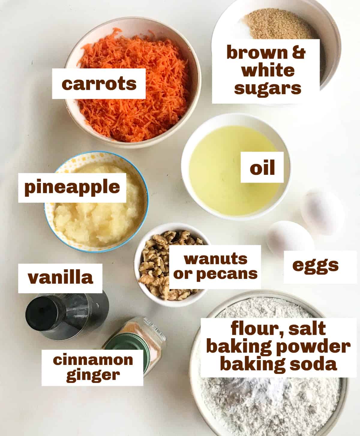 Bowls with carrot pineapple cake ingredients on a white table, image with text