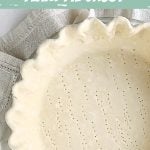 Close-up of partial pie crust with crimped edges, unbaked, green and white text overlay