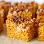 Close up of pumpkin cake squares with pecans