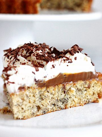 Close up of layered banoffee cake on white plate