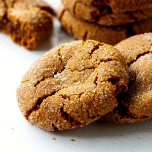 Close up of gingersnap crackled cookies on white surface