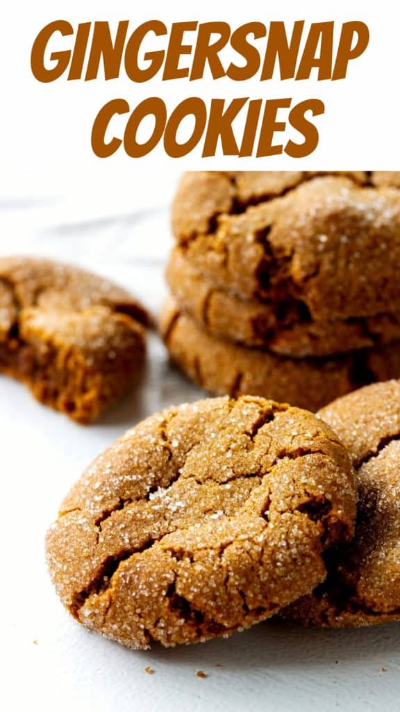 Light brown text over image of several crackled ginger cookies