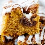 Iced pumpkin cake squares on top of each other