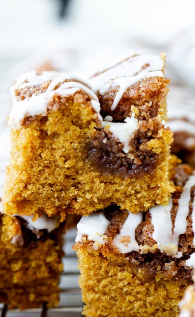 Iced pumpkin cake squares on top of each other
