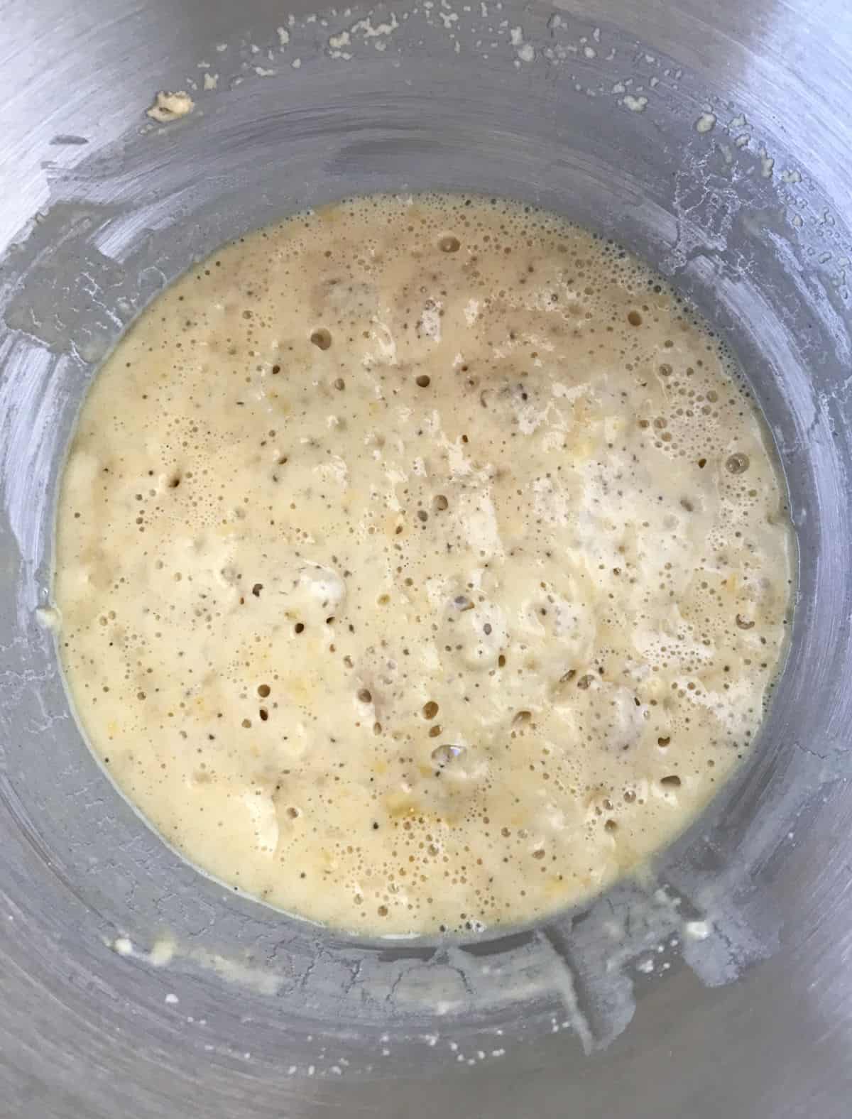 Bubbly yeast mixture in a metal bowl