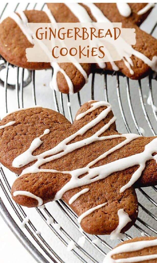 Image with text of iced gingerbread cookie person cut out on metal wire rack