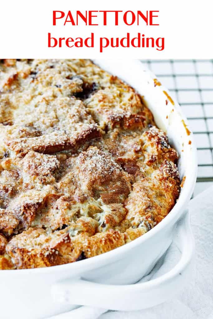 Golden baked bread pudding in oval white dish with red text