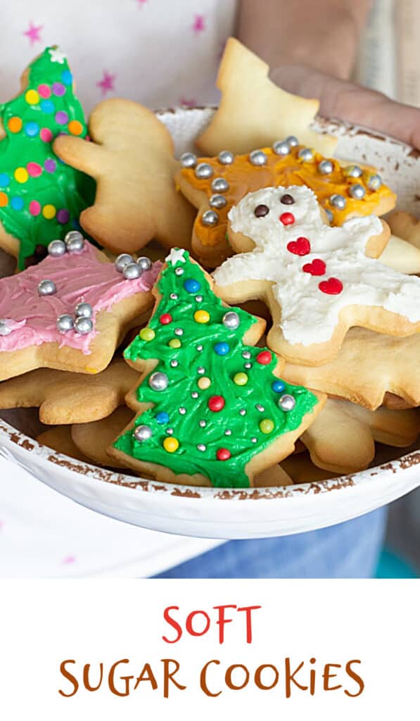 Several frosted colorful holiday cookies on white bowl, red text on image