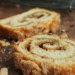 Slices of swirl bread on a wooden table; orange text overlay