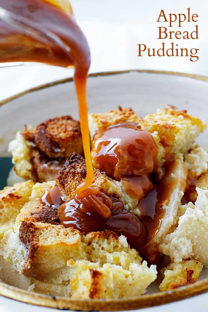Drizzle of caramel pouring over serving of apple bread pudding, text overlay