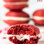 One bitten red velvet whoopie pie on marble surface, stack of pies in background; red text overlay
