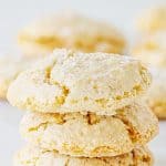 Three stacked almond cookies on white background; brown white text overlay