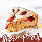 Burgundy white text overlay on slices of plum cake.