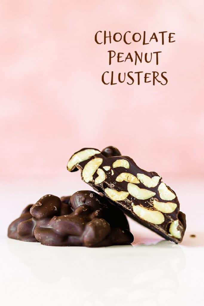 Pink white background with two chocolate peanut clusters, one is cut; brown text overlay