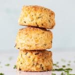Close up of three stacked scones with light colored background