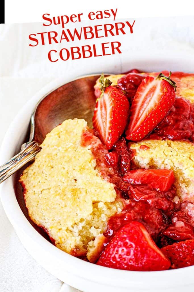 Close up of white bowl with strawberry cobbler and silver spoon; red text overlay