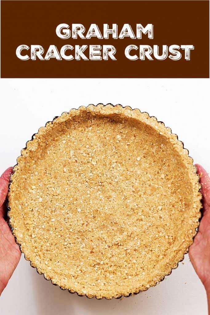 Round graham cracker pie crust on white surface, brown white text overlay