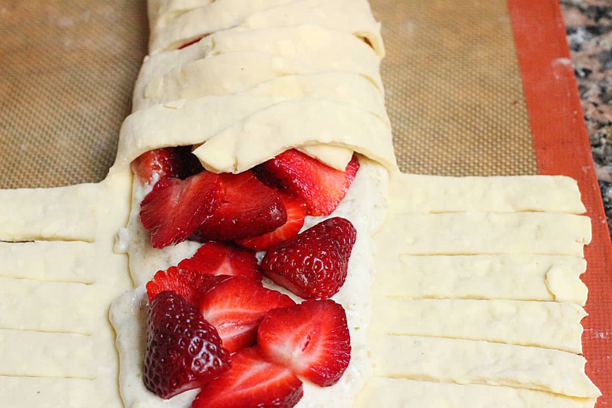 Half closed danish braid with strawberry filling on silpat