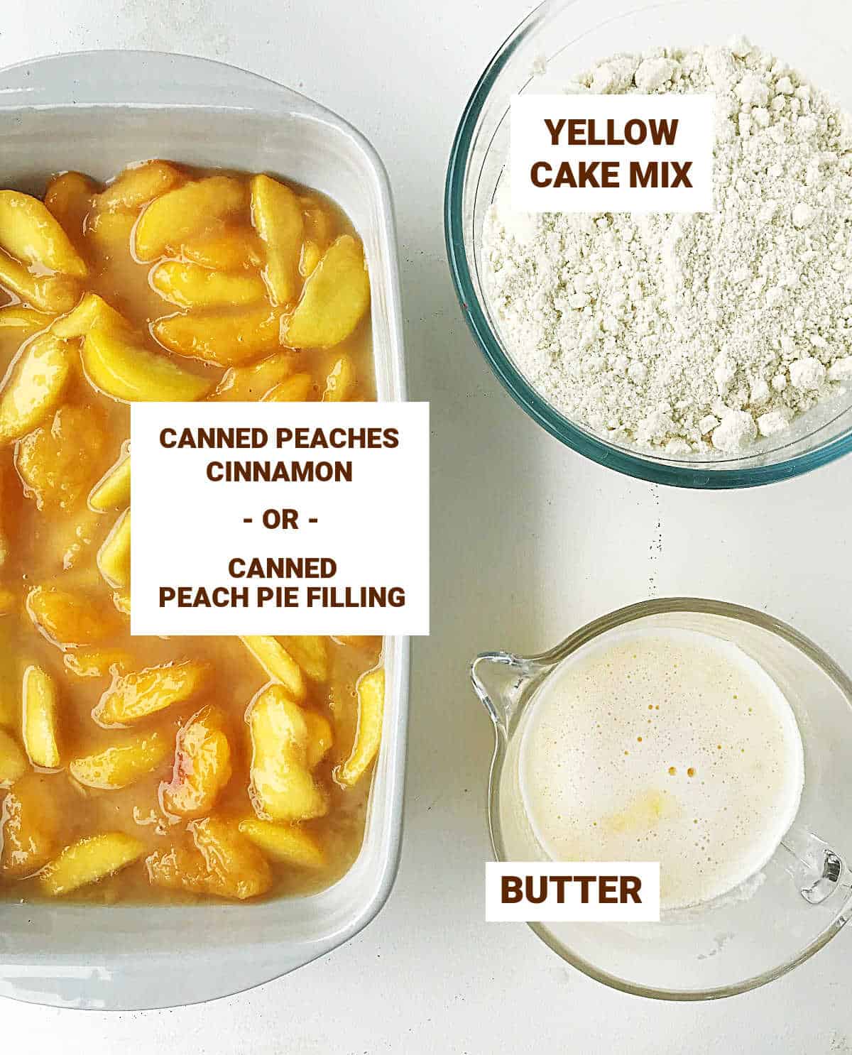 Ingredients for peach dump cake on white surface including melted butter, cake mix and peach filling.
