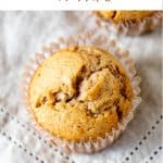 Top view of single muffin on grey napkin, brown test overlay