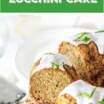 Cut zucchini bundt cake on white cake stand, green text overlay