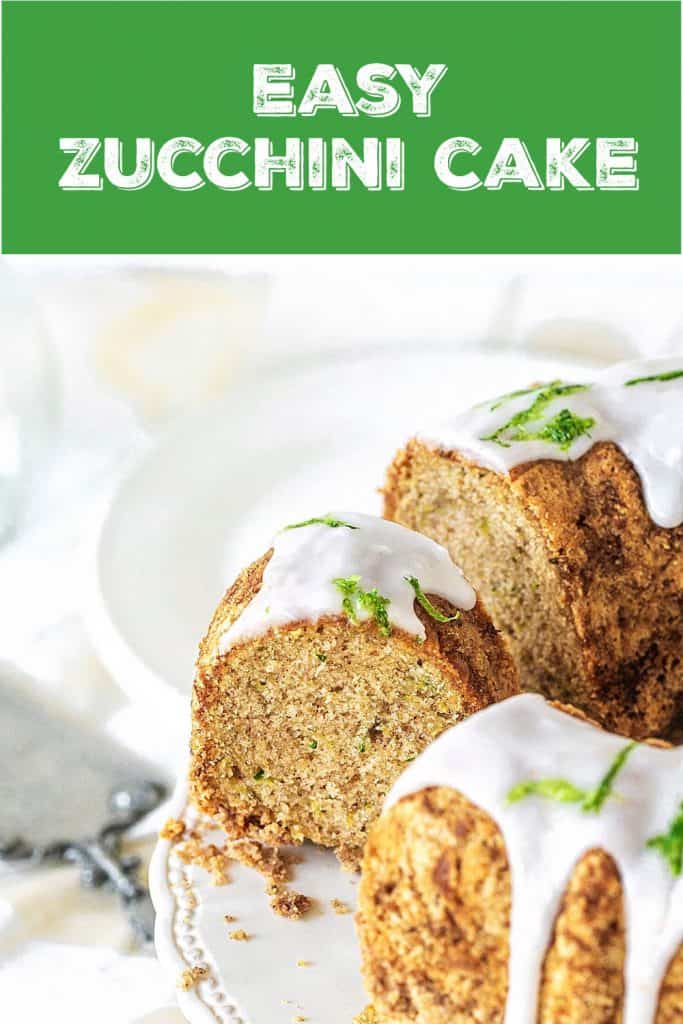 Cut zucchini bundt cake on white cake stand, green text overlay
