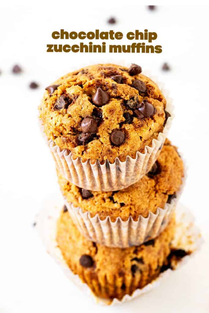 A stack of three muffins with chocolate chips in paper cups, white background, brown text overlay