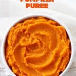 Close up of white bowl with pumpkin puree on white surface, orange text overlay