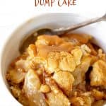 White background, brown text overlay and white bowl with caramel apple cobbler and a spoon