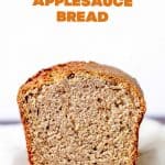 Front view of cut applesauce loaf, white surface and background, orange text overlay