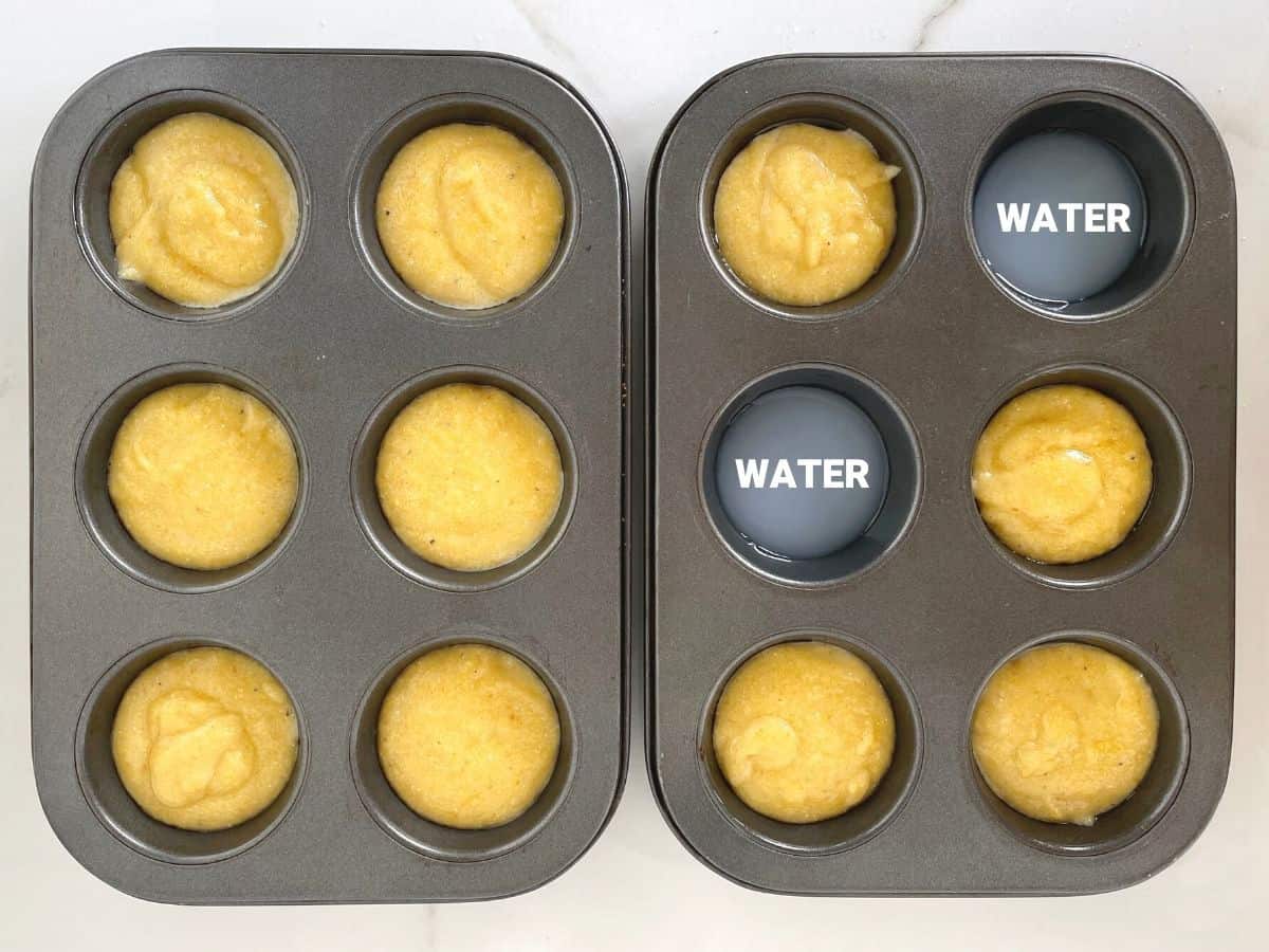 Metal muffin pans with unbaked cornbread batter on a white surface.