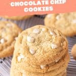 Pink and white text overlay on image of stack of white chocolate chip cookies on a wire rack.