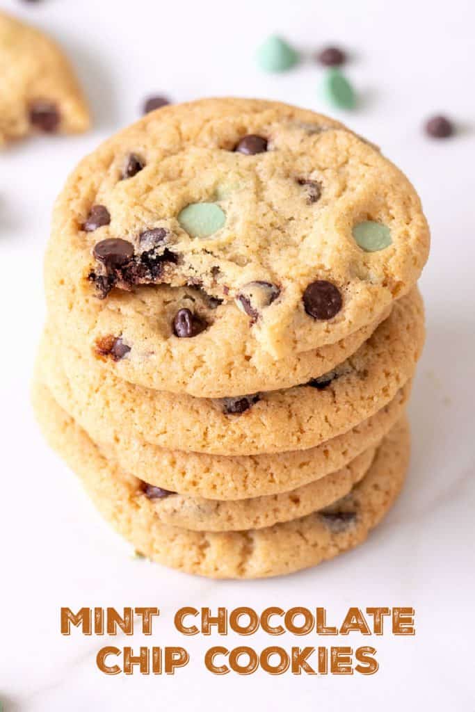 Close up of stack of chocolate chip mint cookies on white surface, brown text overlay