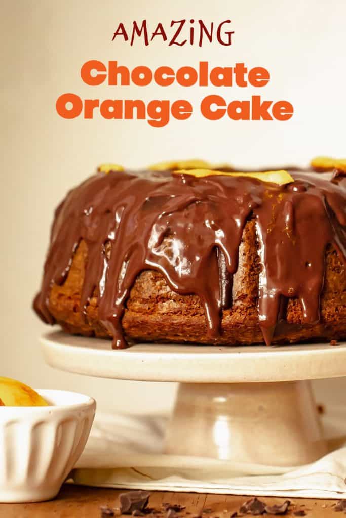 Cake stand with chocolate glazed bundt cake, beige background, orange brown text overlay.