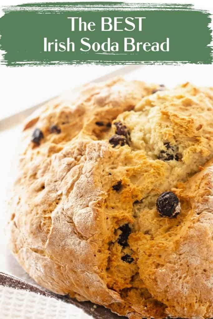 Round loaf of raisin bread with green text overlay.