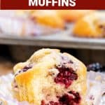 Brownish text overlay on image with half eaten blackberry muffin on paper liner, grey wood surface.