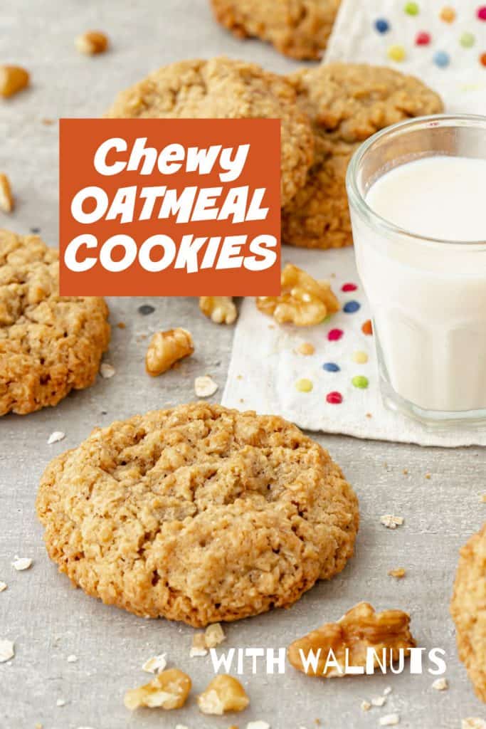 Orange white text overlay over image of grey background with oatmeal cookies, glass of milk, and loose walnut pieces.