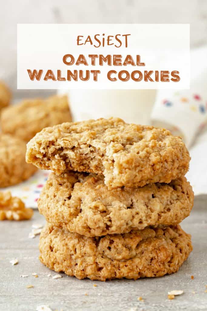 Stack of oatmeal cookies, one bitten, on grey surface; white brown text overlay.