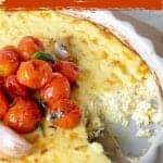 Close up of eaten baked ricotta with tomatoes on pie dish. Orange white text overlay.
