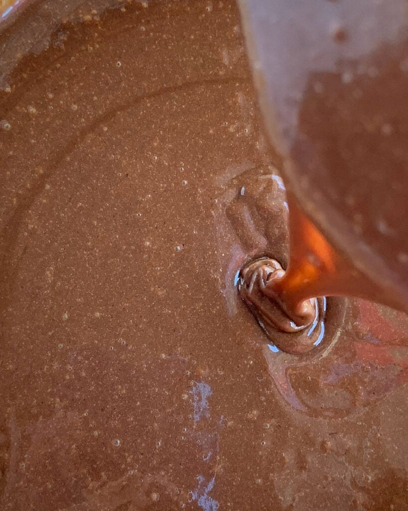 Close up of chocolate icing for condensed milk cake.