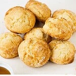 Black and white text overlay on two images of baked and unbaked scones.