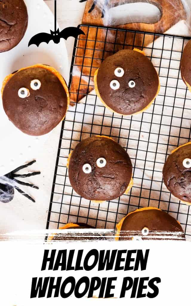 Top view of halloween whoopie pies on a black wire rack with black text overlay and thematic graphics.