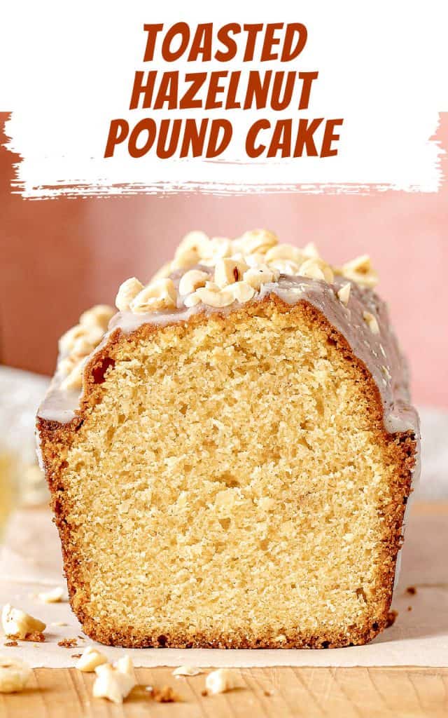 Front view of cut hazelnut pound cake on paper and a wooden board. Brown and white text overlay.