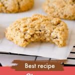 Oatmeal cookies, whole and bitten on parchment paper with pink and brown text overlay.