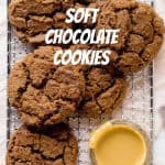 Cracked chocolate cookies seen from above on a wire rack with peanut butter in a bowl. Text overlay.