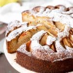 Close up of pear cake on pink cake stand.
