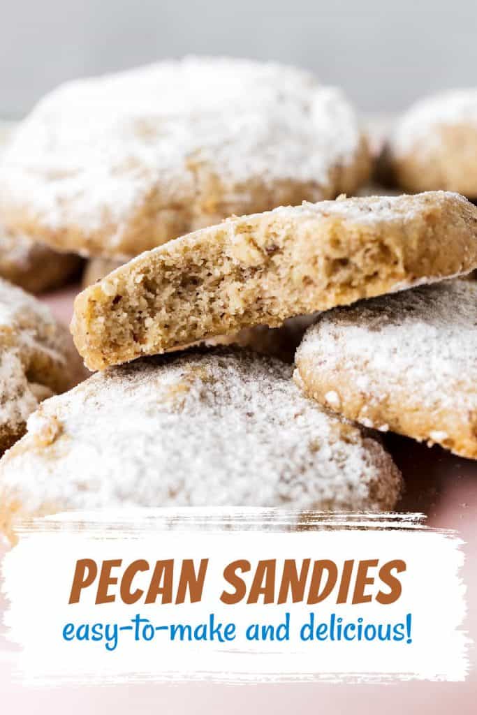 One bitten pecan cookies on a pile of more cookies with powdered sugar. Brown and blue text overlay.